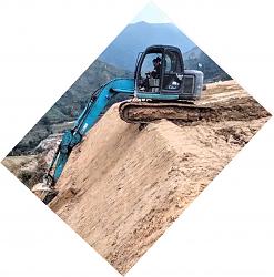 Mini excavator moves down vertical cliff - GIF-fixedimage.jpg