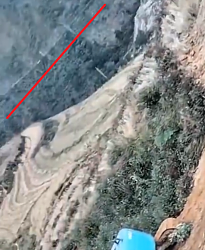 Mini excavator moves down vertical cliff - GIF-screenshot-2024-12-15-162139.png